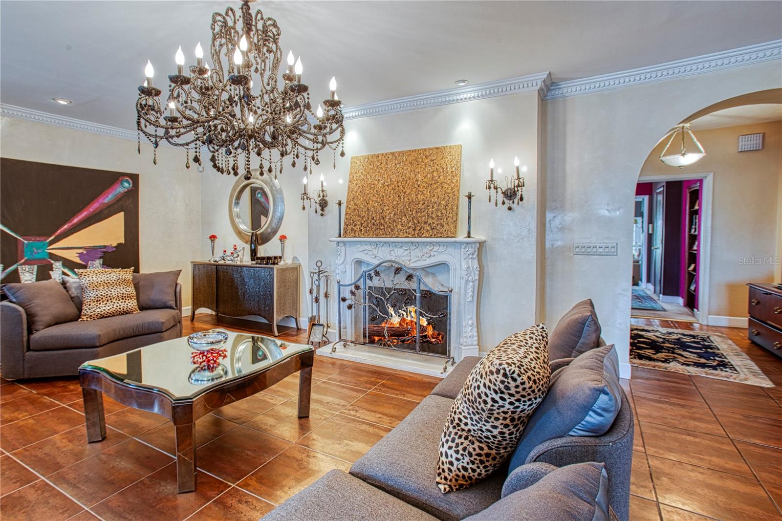 Family room fireplace with hand carved marble mantle