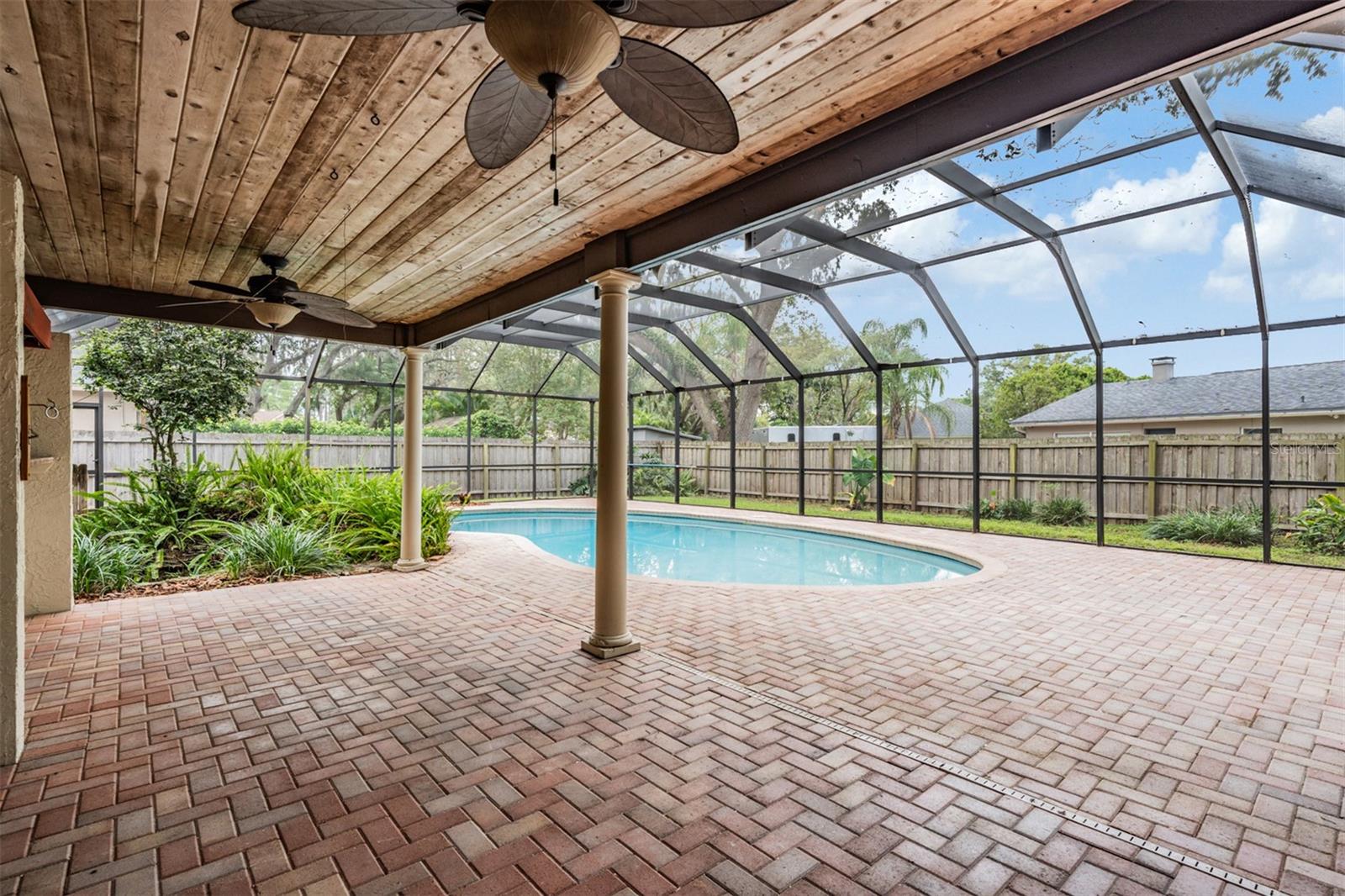 Covered patio area with tongue in groove ceiling
