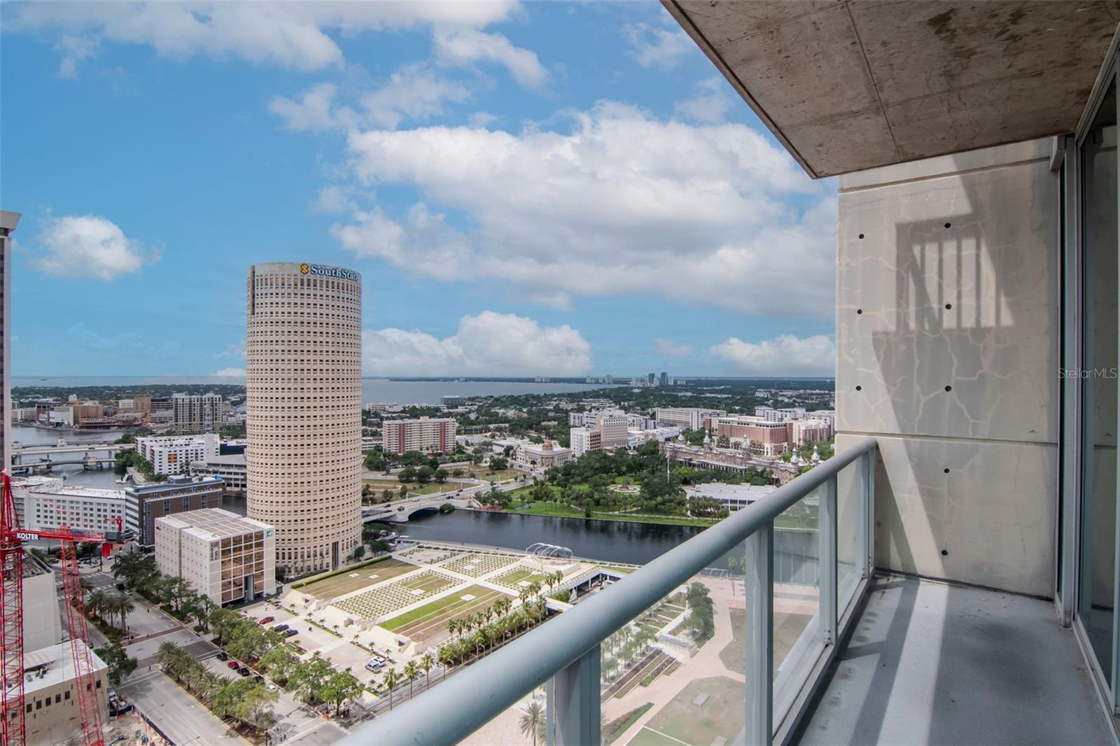 Private covered terrace with sweeping Hillsborough River and skyline vistas—ideal for morning coffee.