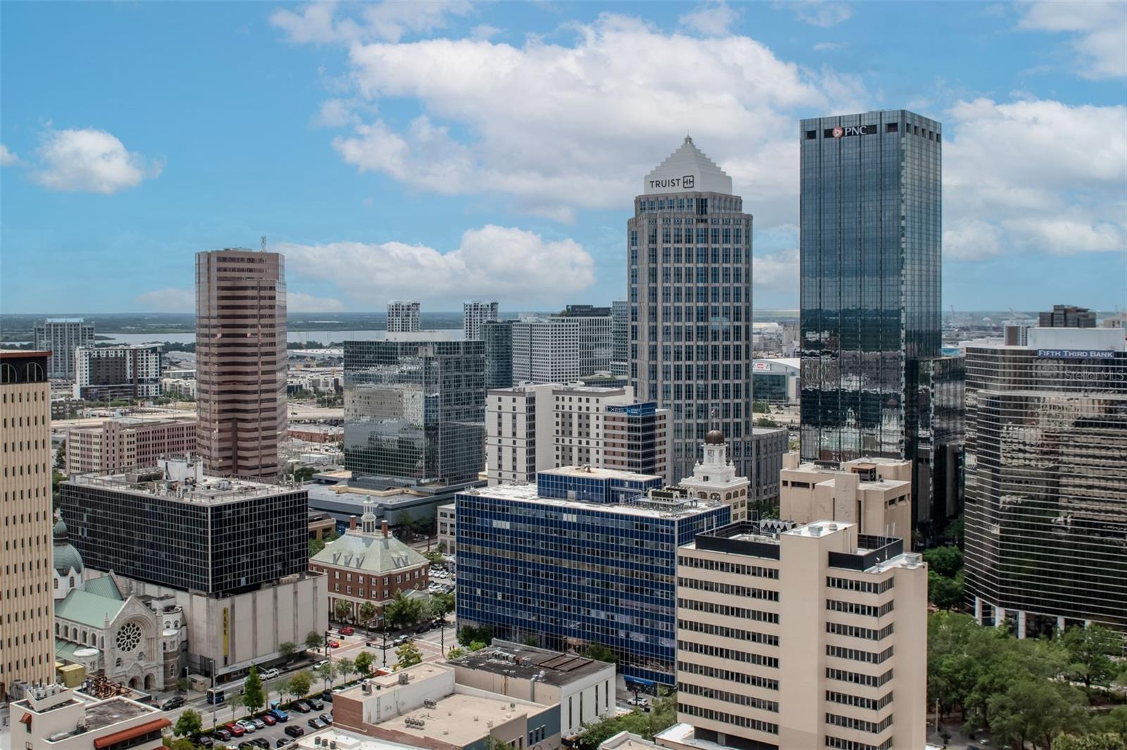 Wide-angle exposure from the balcony captures the Wilson, Truist, and ConnectWise buildings.