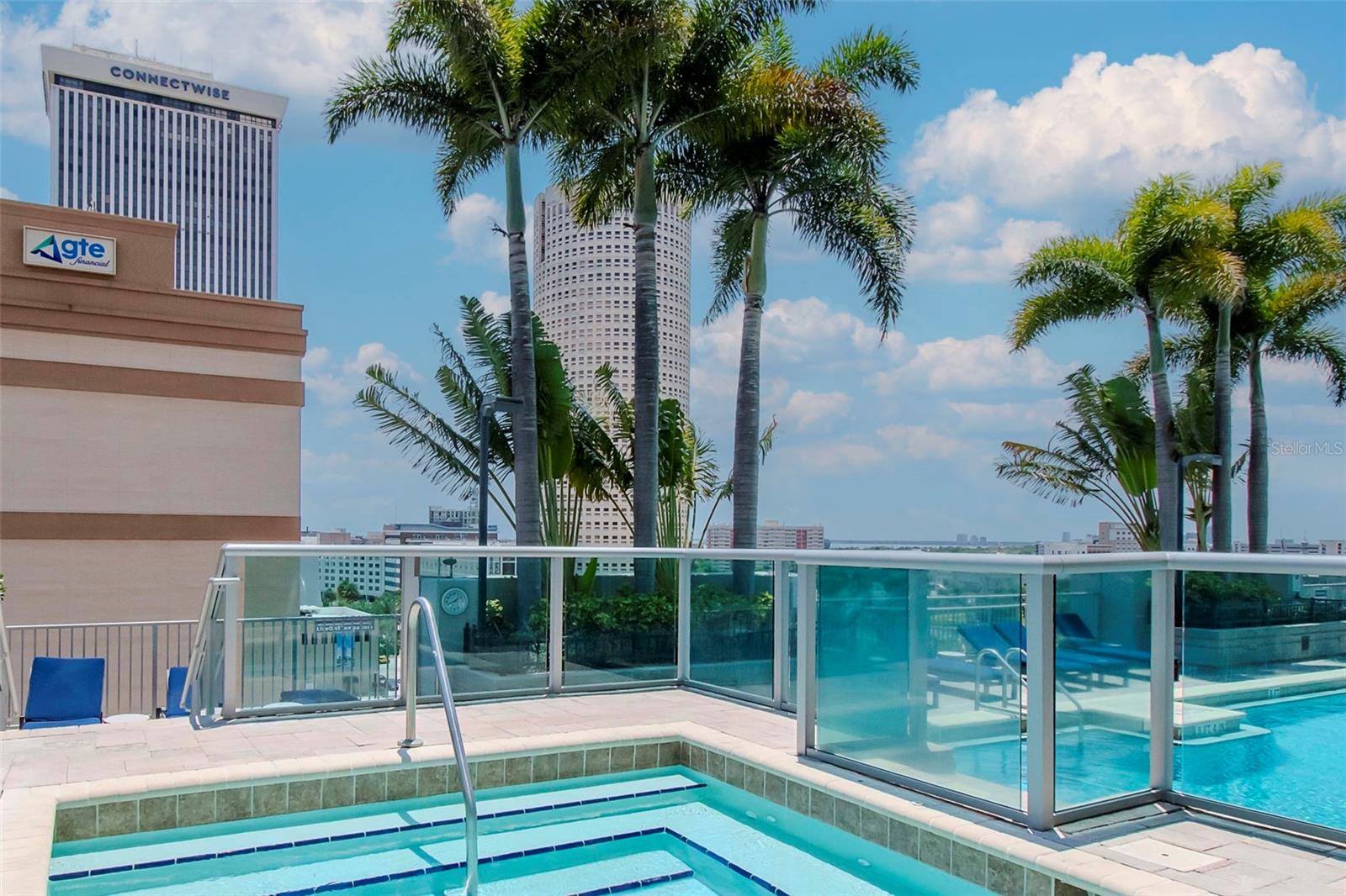 Elevated spa overlooking the pool deck—perfect for relaxation after a workout.