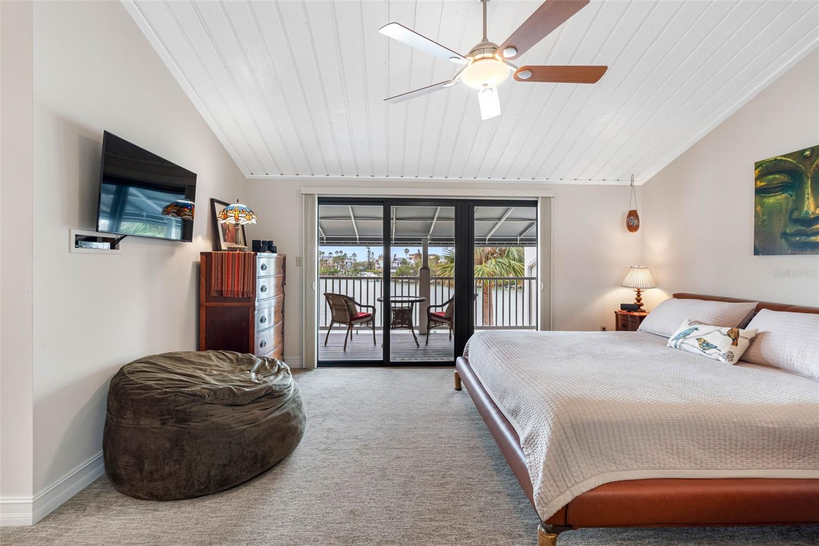 Luxurious primary suite with high ceiling.