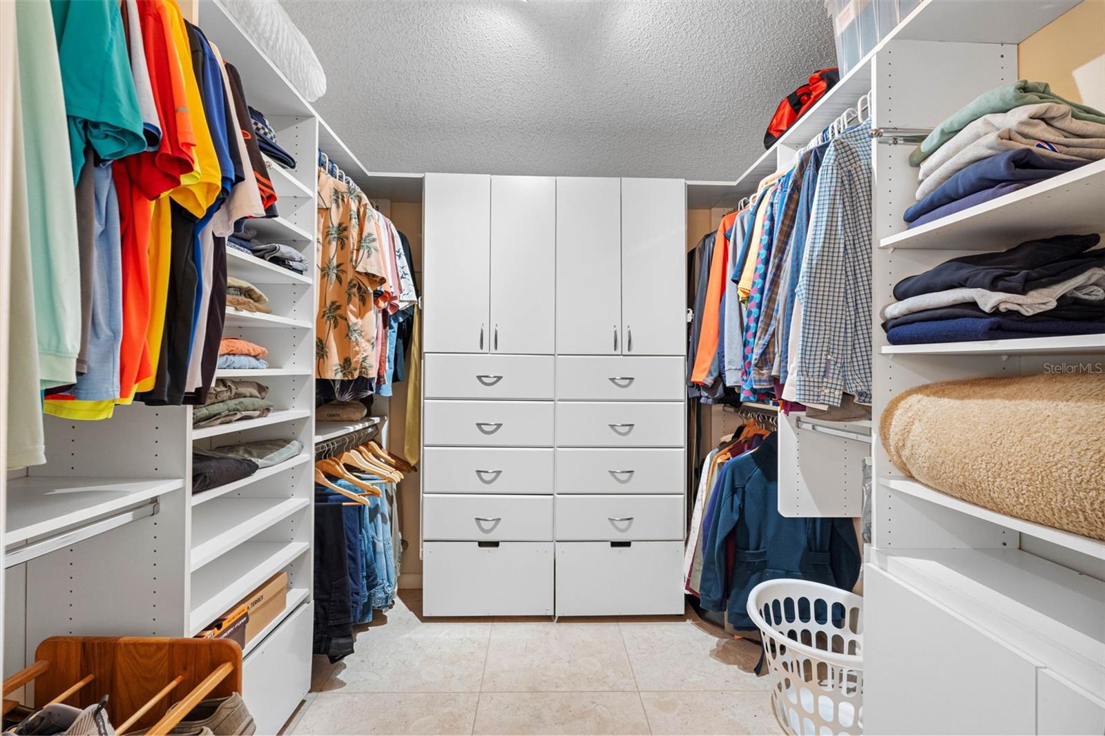 Walk-in closet with built-ins.