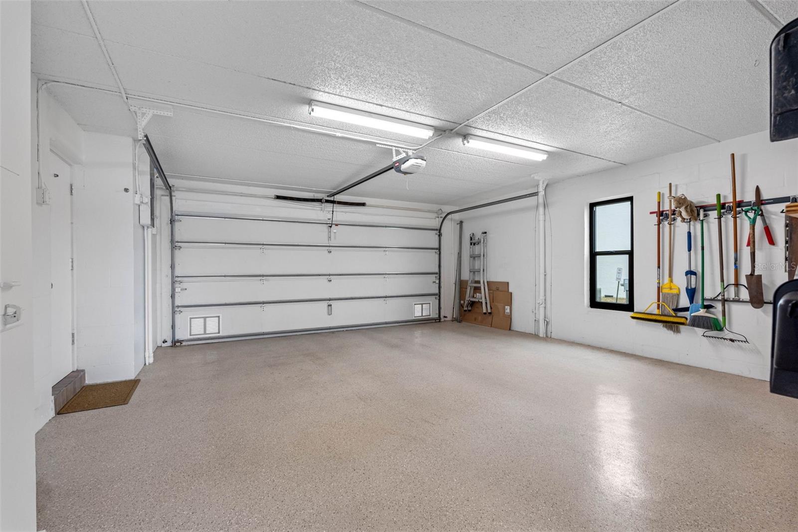 Two-car garage with hurricane impact garage door.