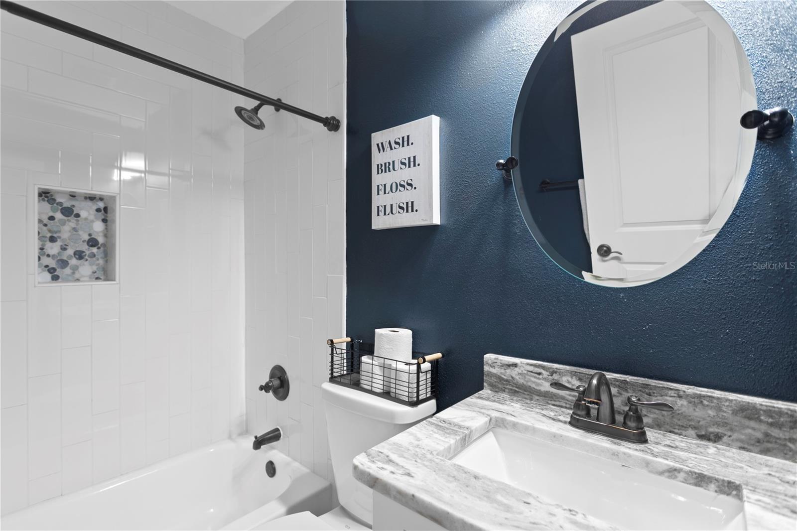 Full bathroom with shower and tub