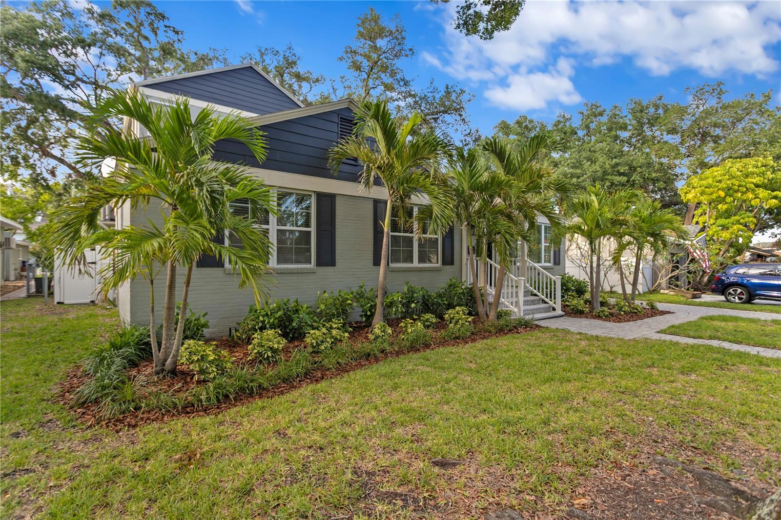 Tropical landscaping in front adds to the beauty!