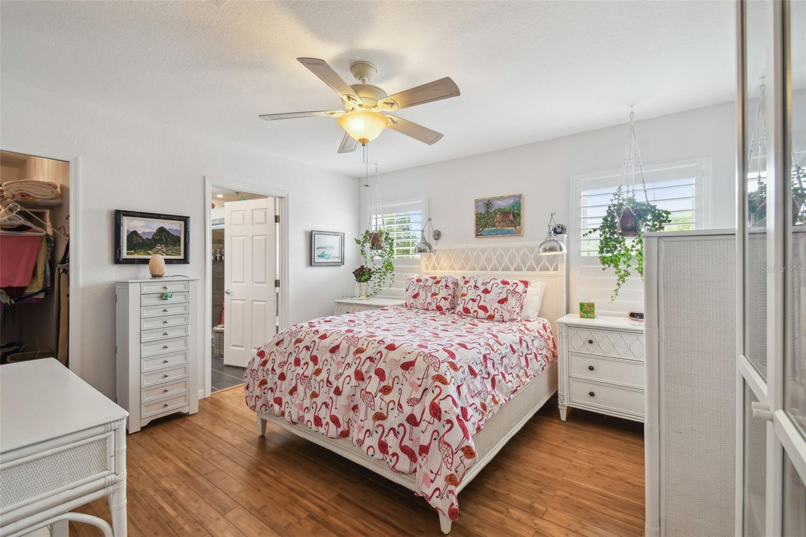 Primary Bedroom with bamboo flooring, 2 walk-in closets and a fully renovated bathroom.