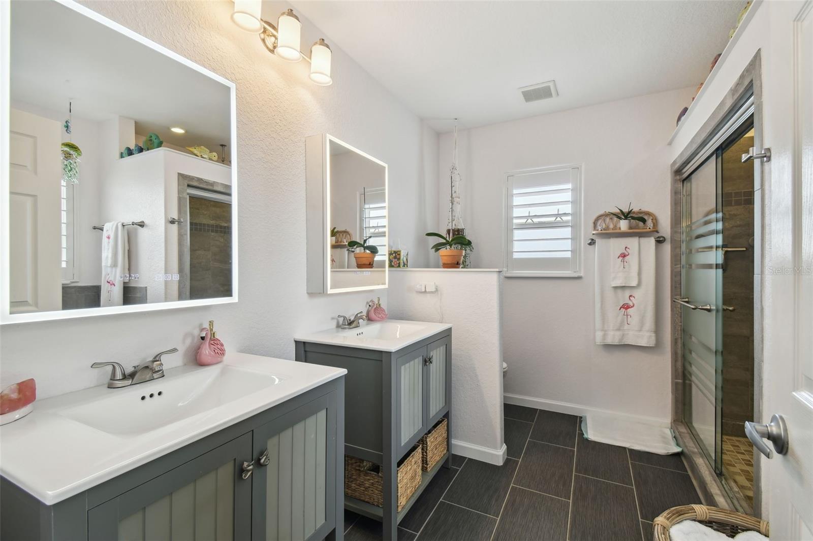 Primary Bathroom with double sinks, oversized shower and soaking tub.