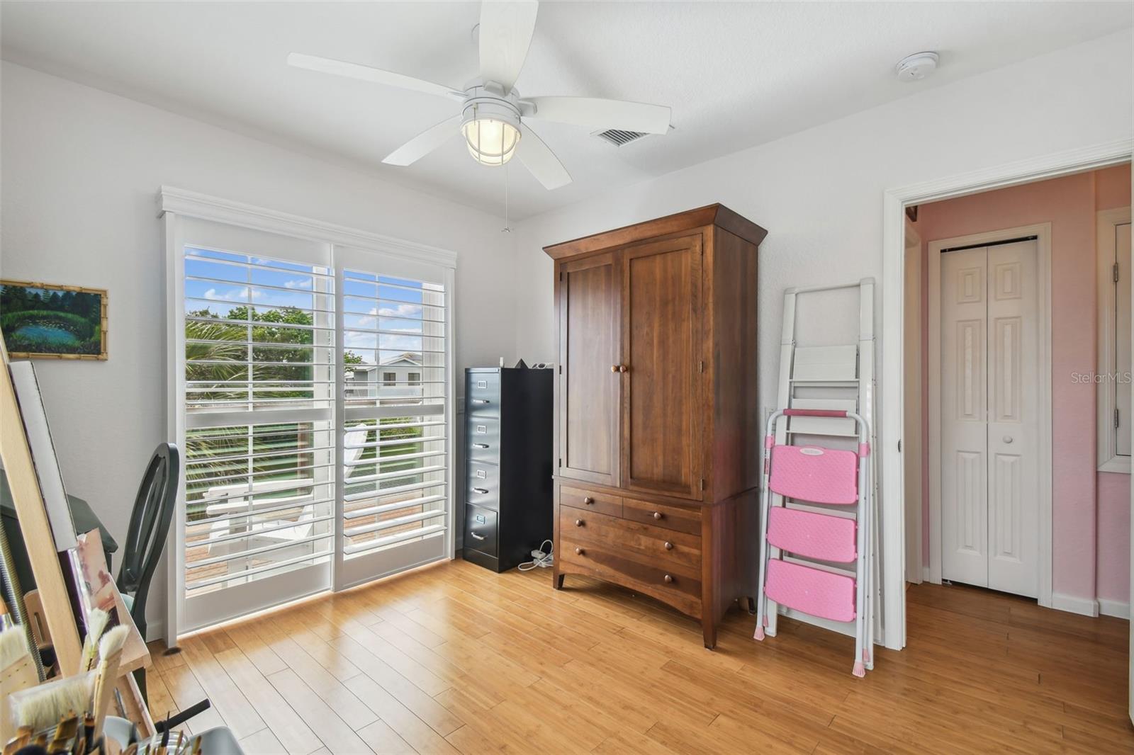 Art room/ office with sliding glass doors to the balcony.