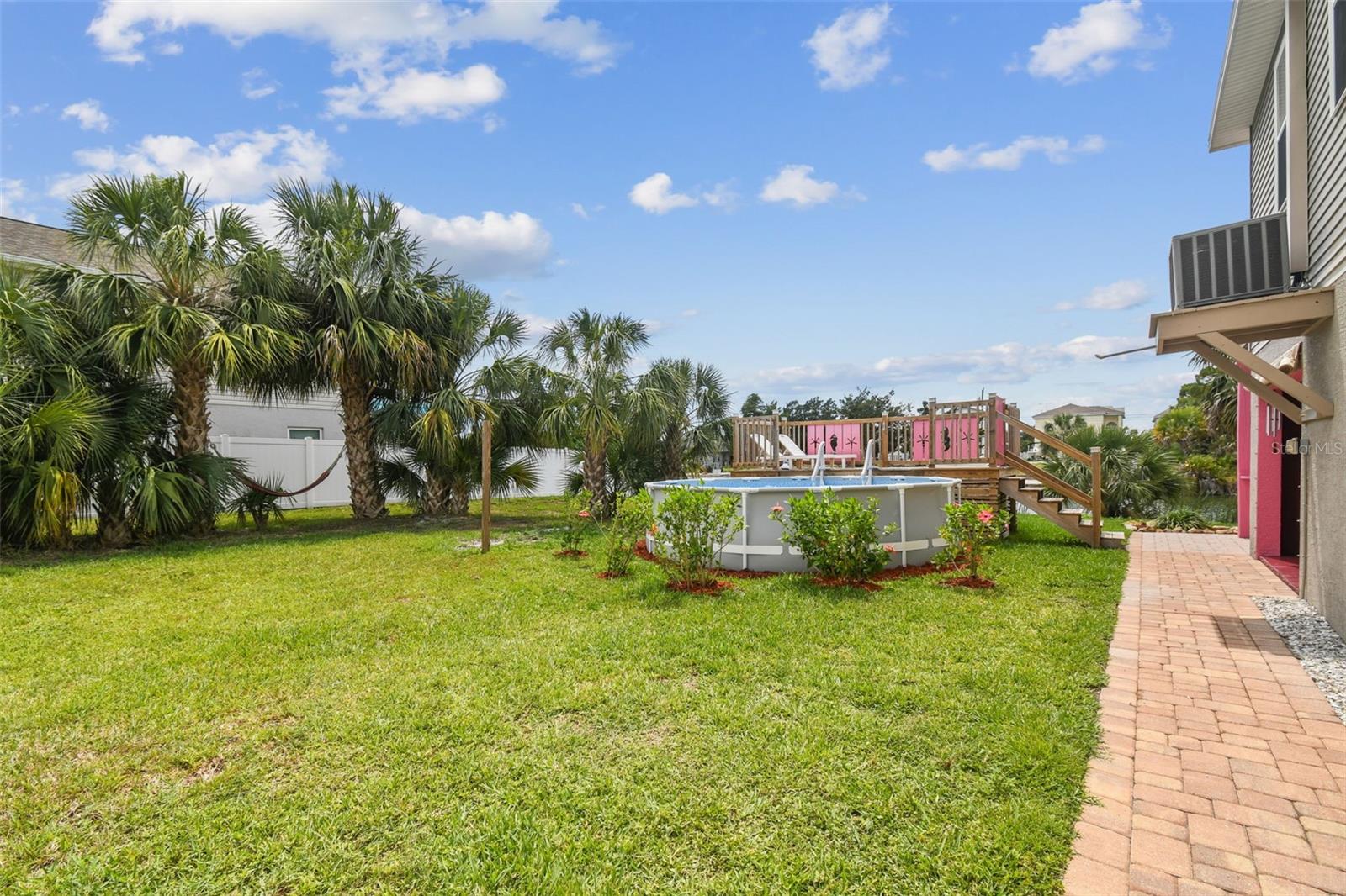 Brand new above ground pool waiting for you to jump in & cool off! AC unit is high & dry (top right) This vacant lot is deeded separately, but sold together with Single Family Residence. Vacant lot MLS number is TB8386293