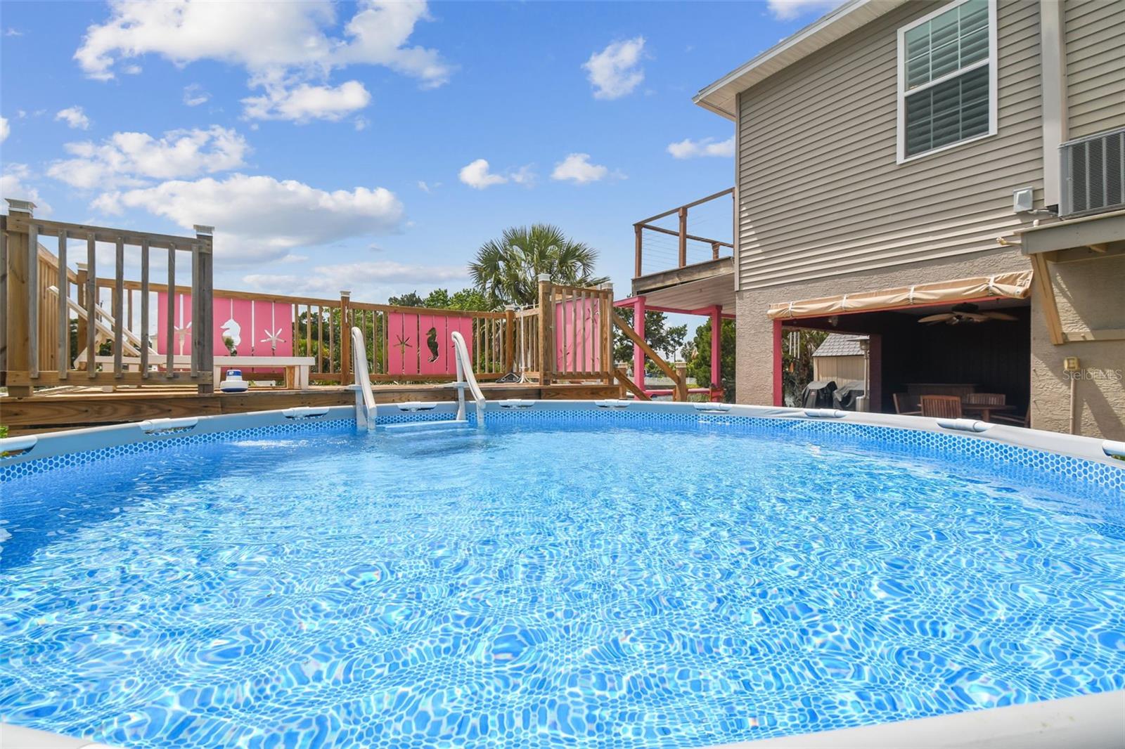 Bring your ice cold beverage and enjoy!!!! Pool is on the vacant lot next door that is deeded separately but sold together with Single Family Residence. Vacant lot MLS number is TB8386293