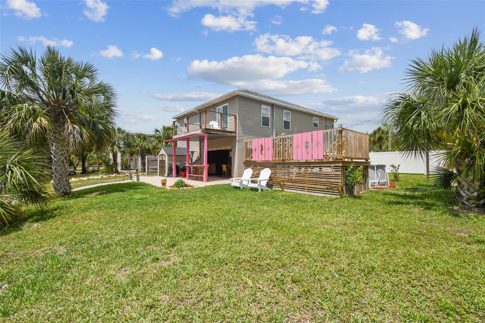 Oversized back yard... pool.... deck... back porch.... dock... covered patio... and plenty of space for a garden. Vacant lot is deeded separately but sold together with Single Family Residence. Vacant lot MLS number is TB8386293