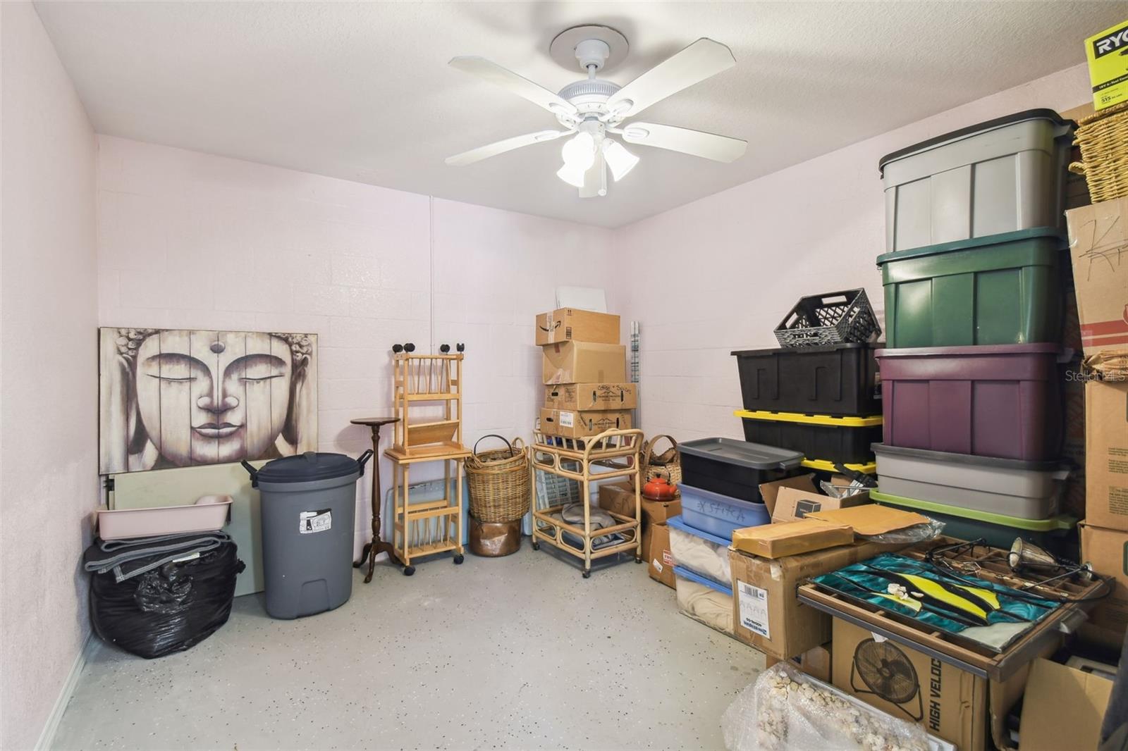 Storage room downstairs.  Big enough to be a bedroom... but it has no windows. This means it's not included in the living square footage of the property.
