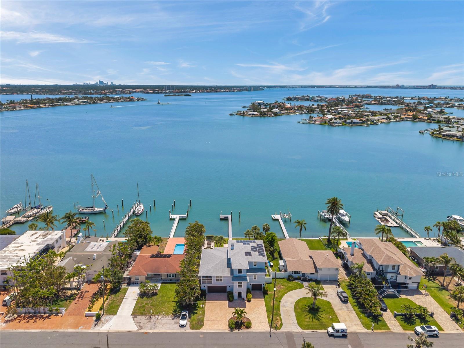 Aerial view of home centered here, showcasing the wide open waters of Boca Ciega Bay. Two islands are within easy paddling distance!