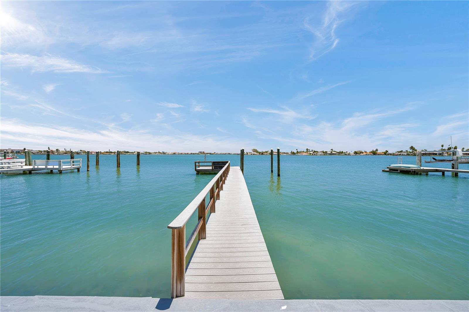A 72-foot dock made of Trex is boat-lift ready. Deep water accommodates larger vessels, and the Gulf is just moments away.