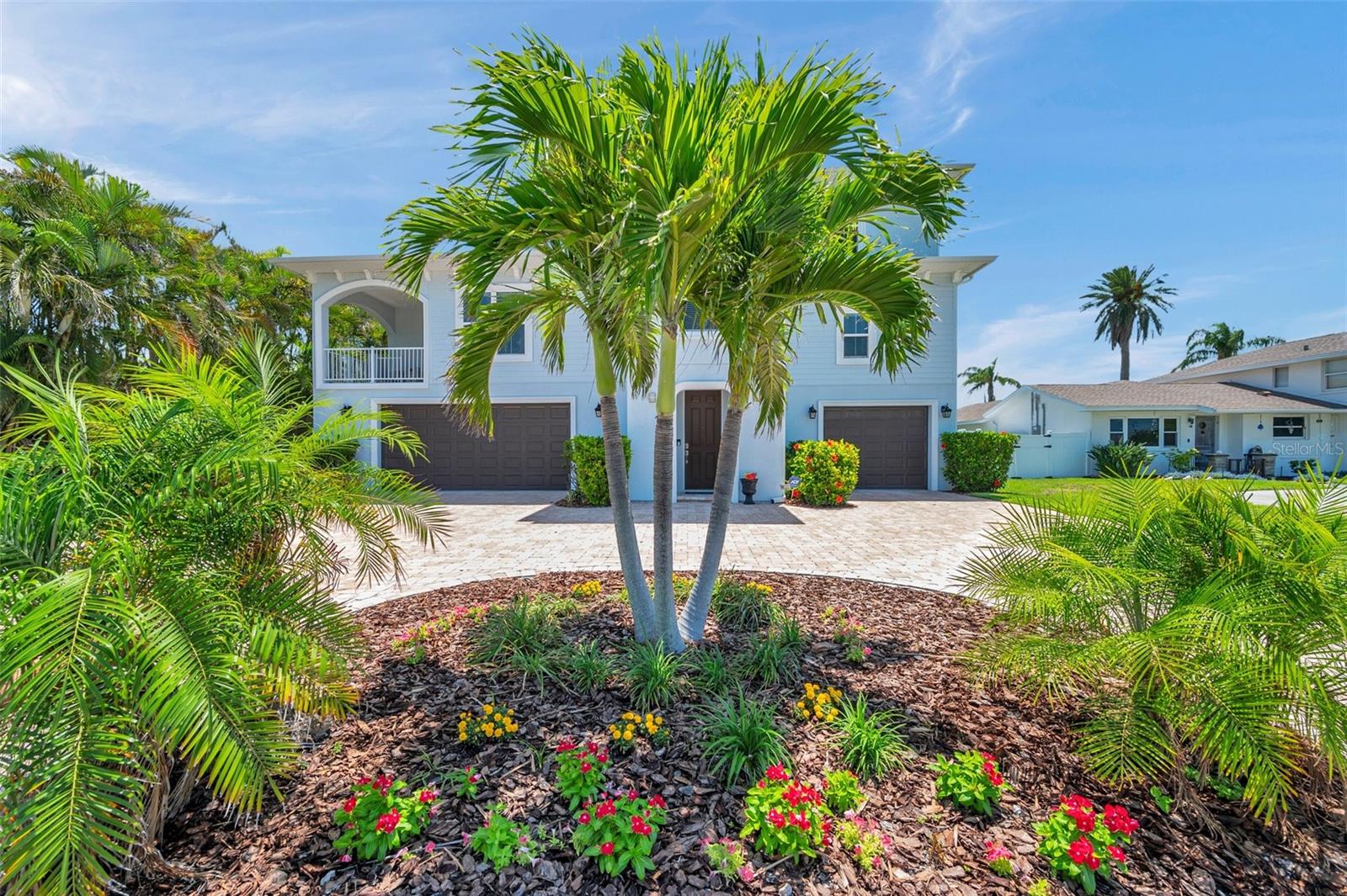 This home is surrounded by lush landscaping.