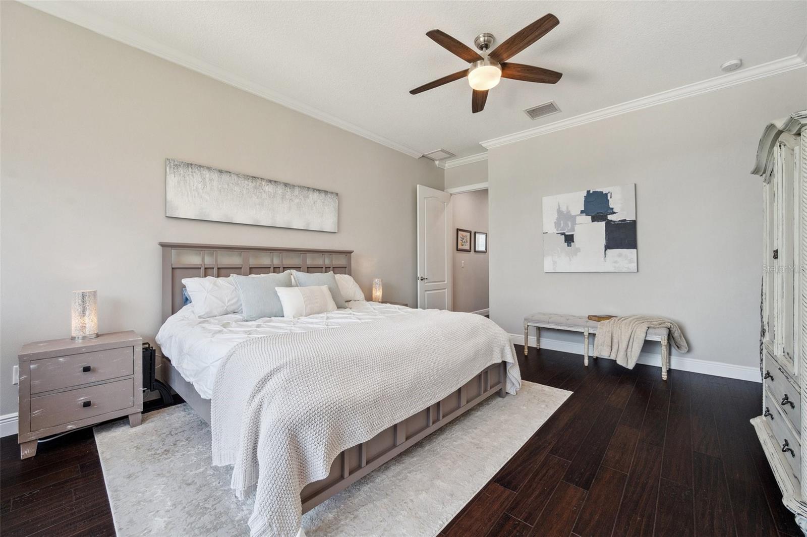 View of master bedroom with entrance from hallway to back left.