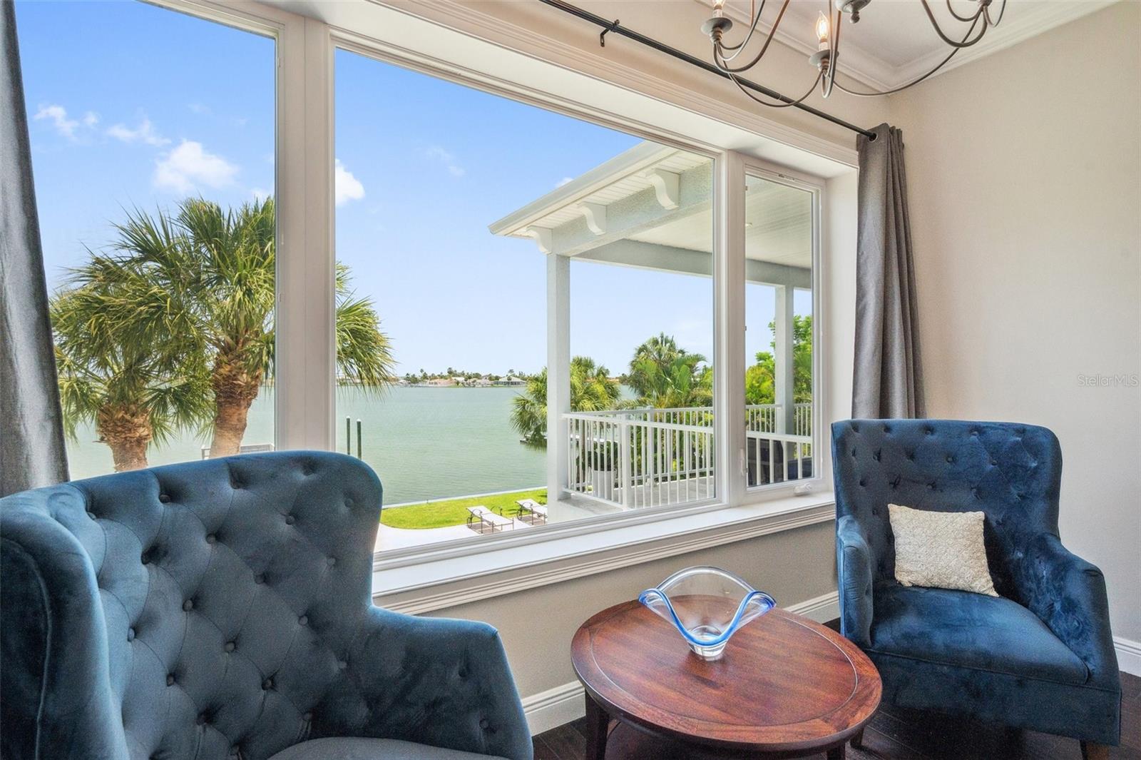 Master bedroom sitting area with partial view of the back balcony... and that amazing wide open water view of Boca Ciega Bay.