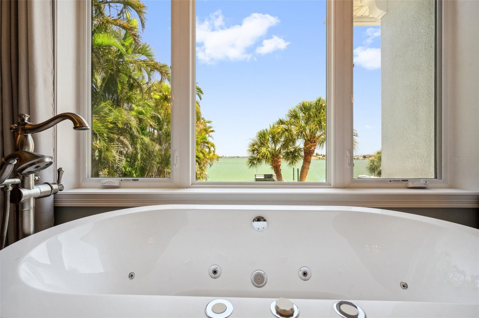 Enjoy a dreamy water view whilst soaking in your jetted tub.