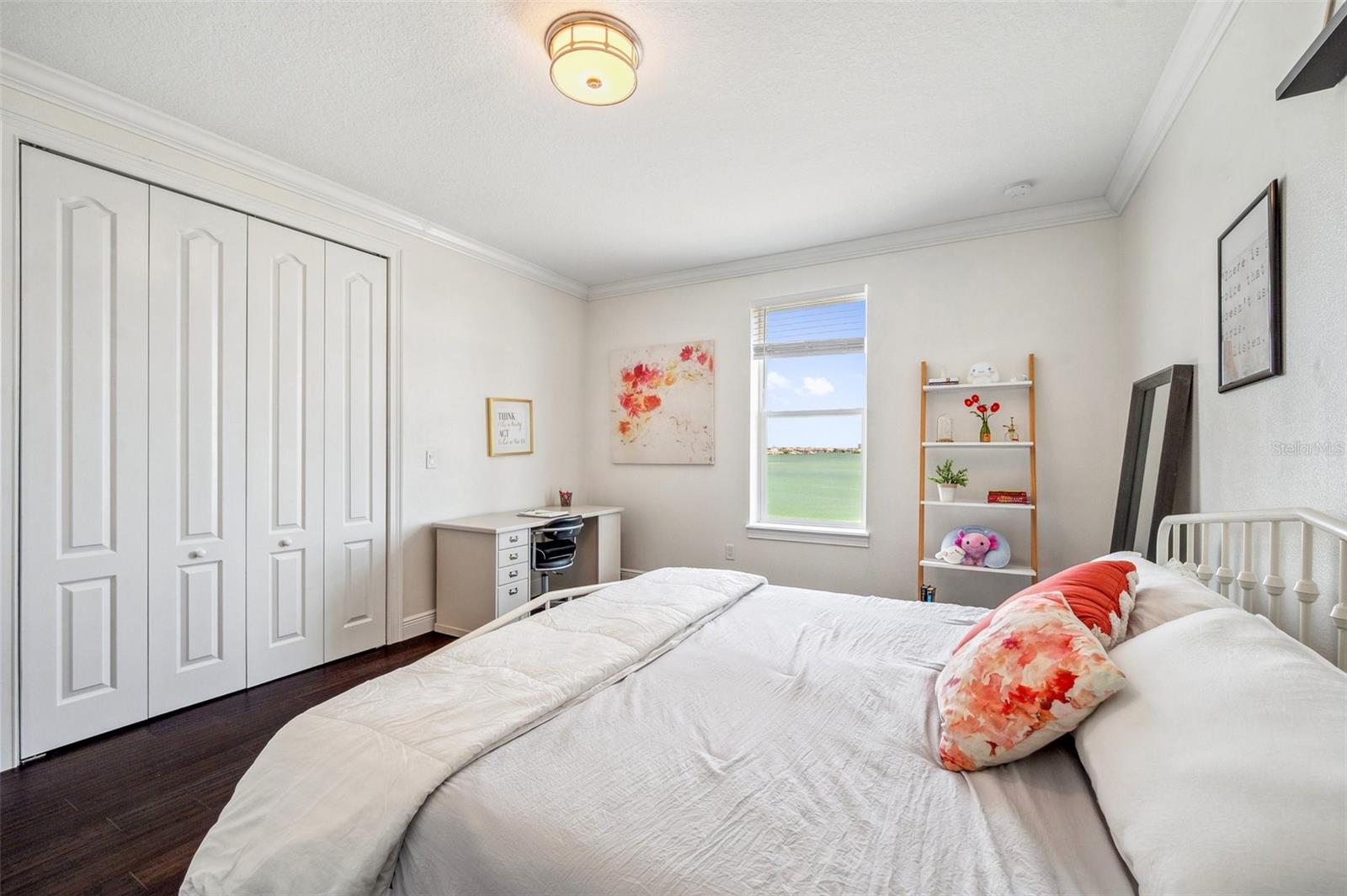 Spacious 3rd floor bedroom with water view.