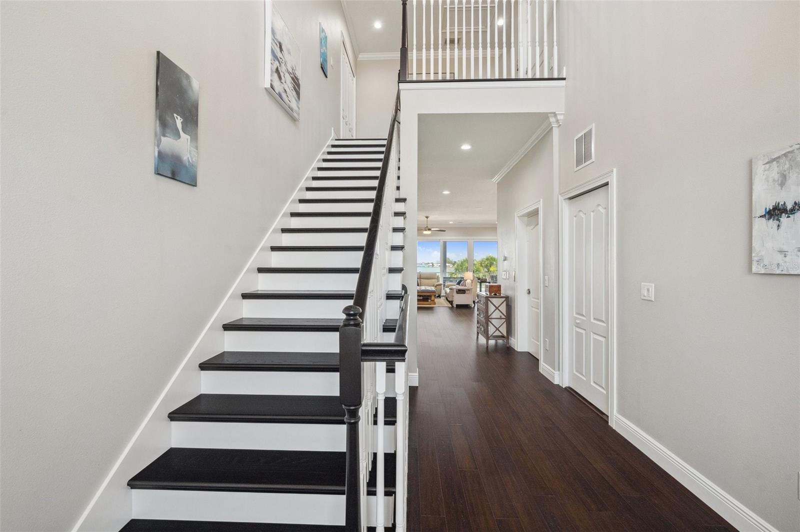 View from entryway/foyer, with stairs leading up to the 3rd floor. (elevator also available)