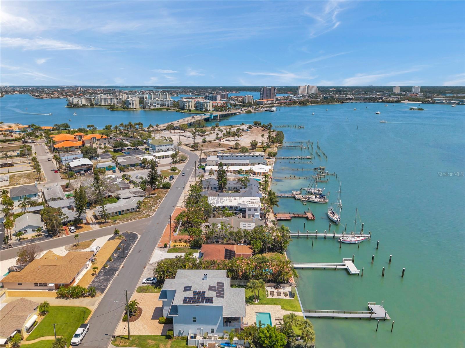 Aerial view showcasing the neighborhood of this luxury waterfront home.