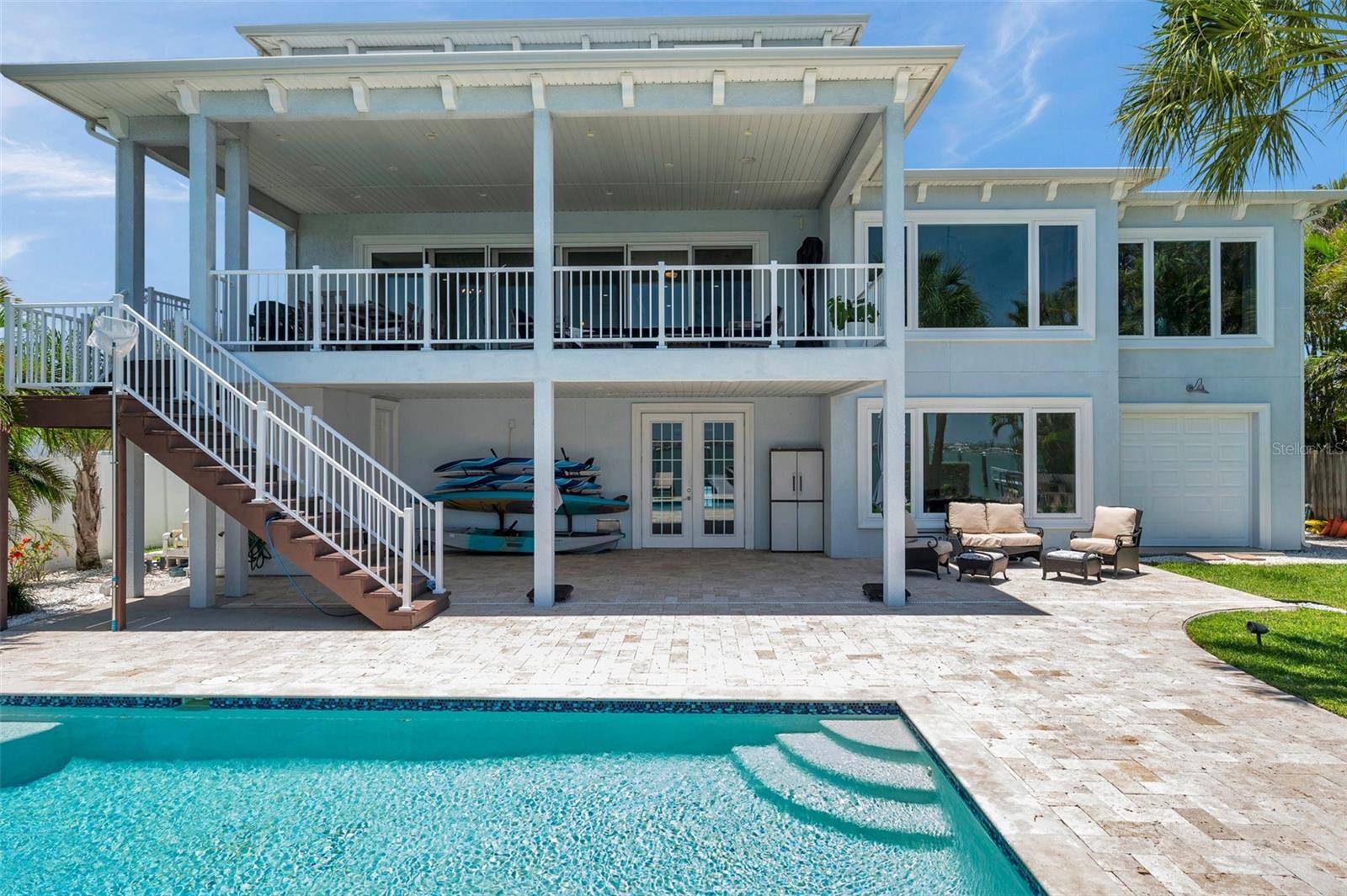 Up close view of the saltwater pool and travertine pool deck offers a great view from the 2nd floor covered balcony or lanai.