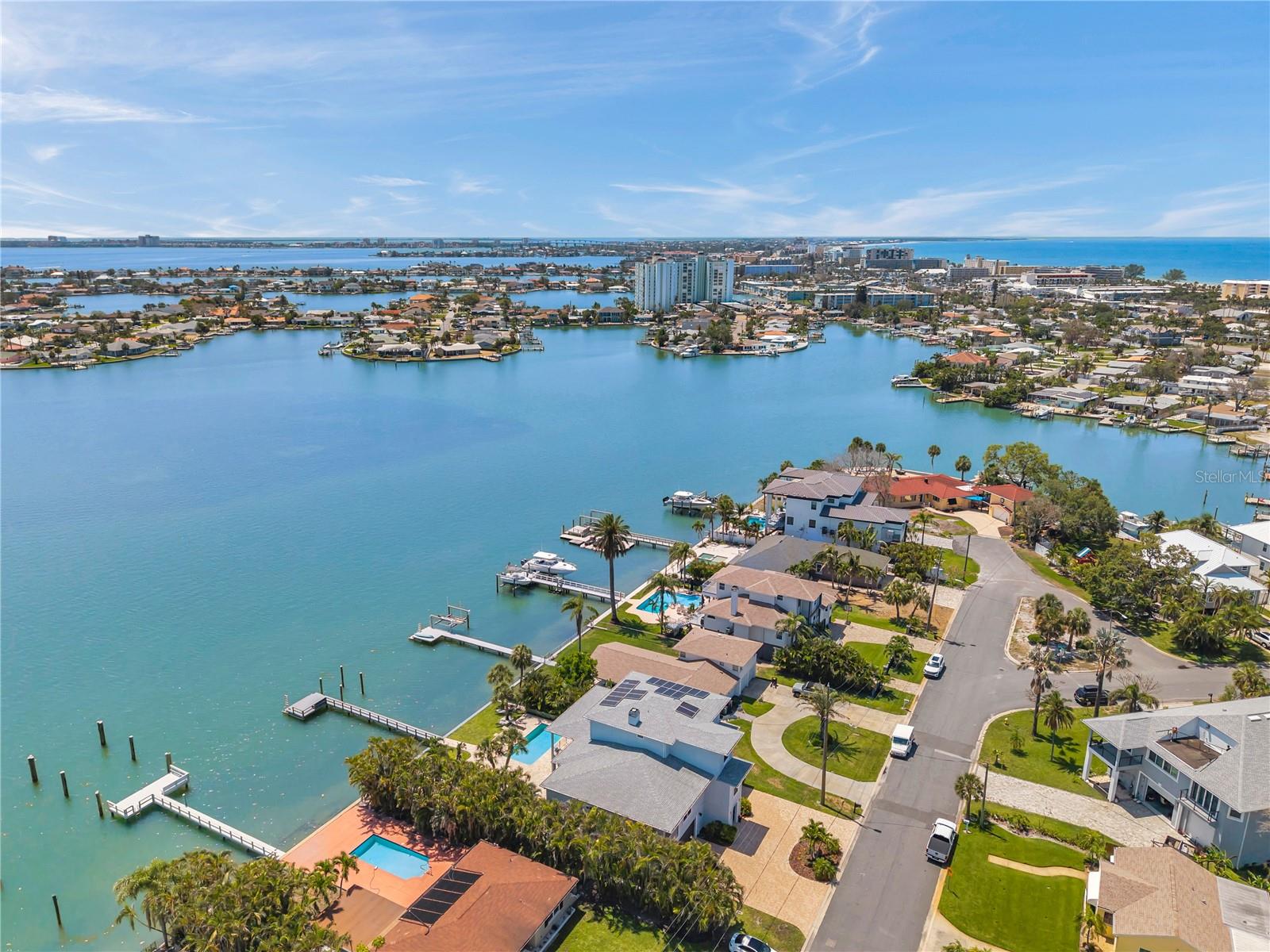 Aerial view showcasing the neighborhood of this luxury waterfront home.