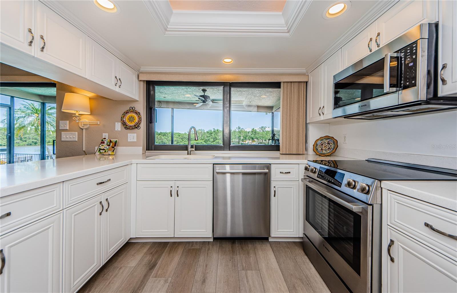 Kitchen sink with a great view through the hurricane rated PGT windows!