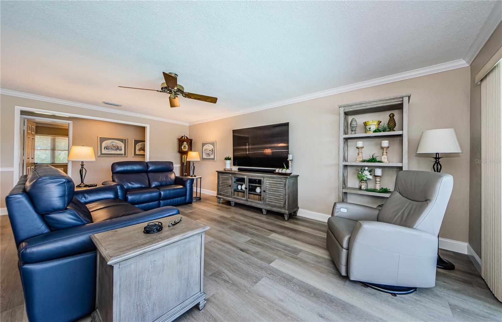 Room for a family movie night and it flows right out to the pool and dock!
