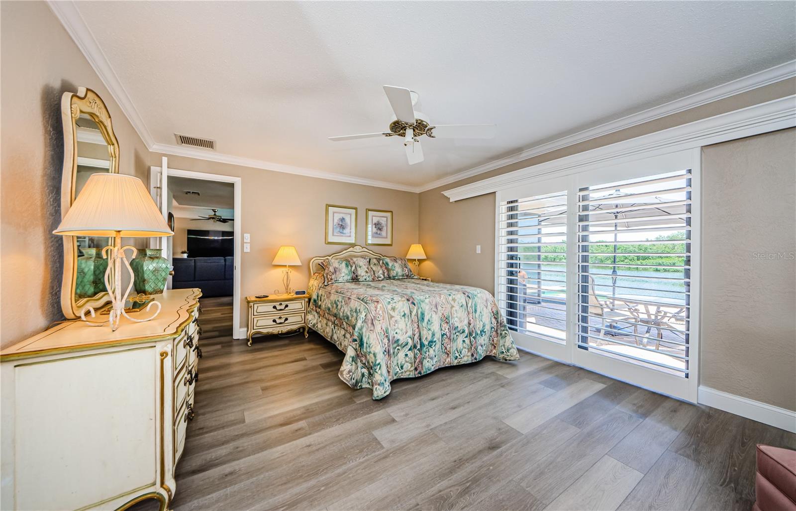 Large master bedroom with new sliding hurricane rated door.