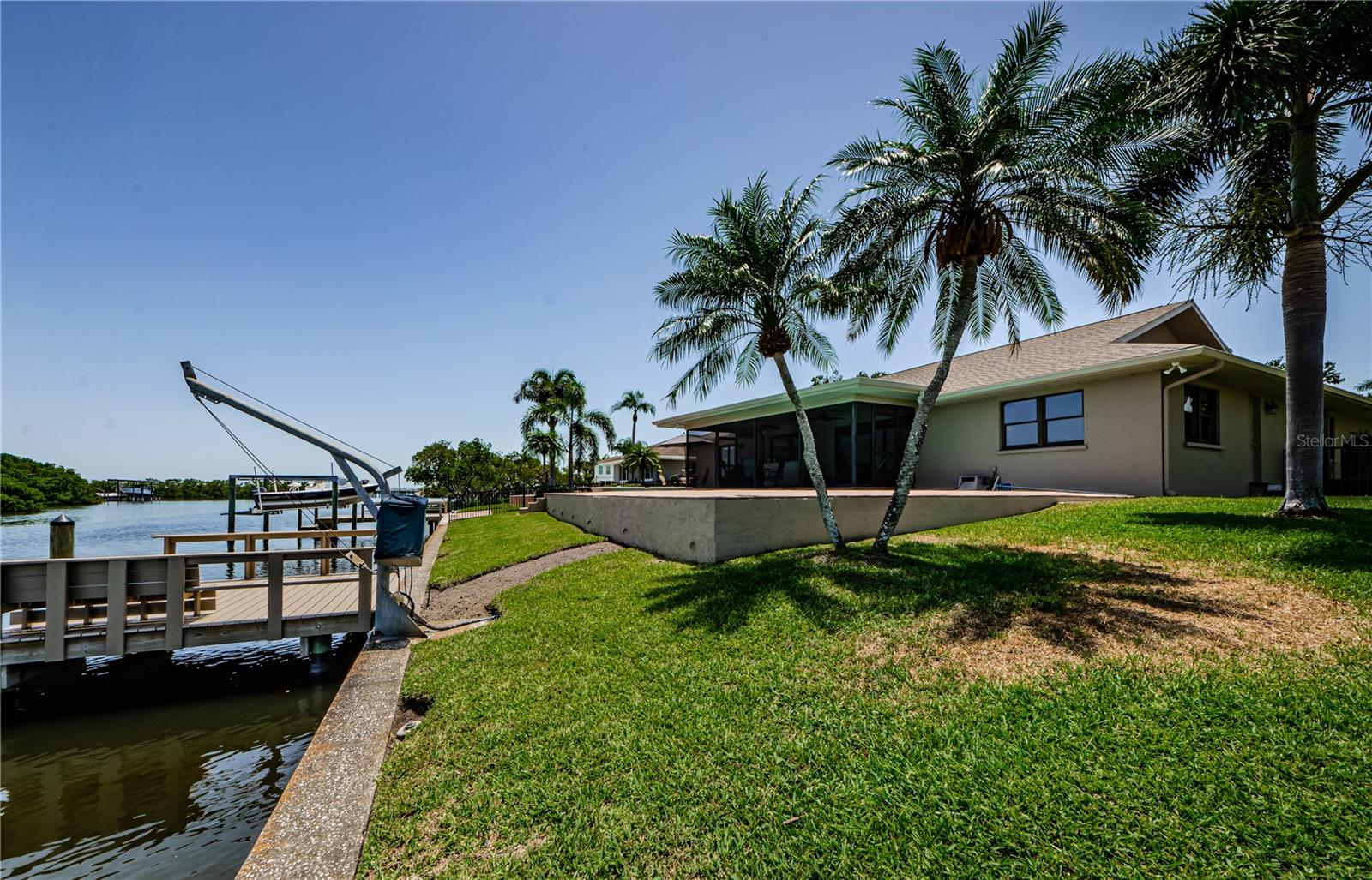 Dock built in 2023 of composite boards, and the davits.  20-30 foot boats have been owned by the neighbors here.