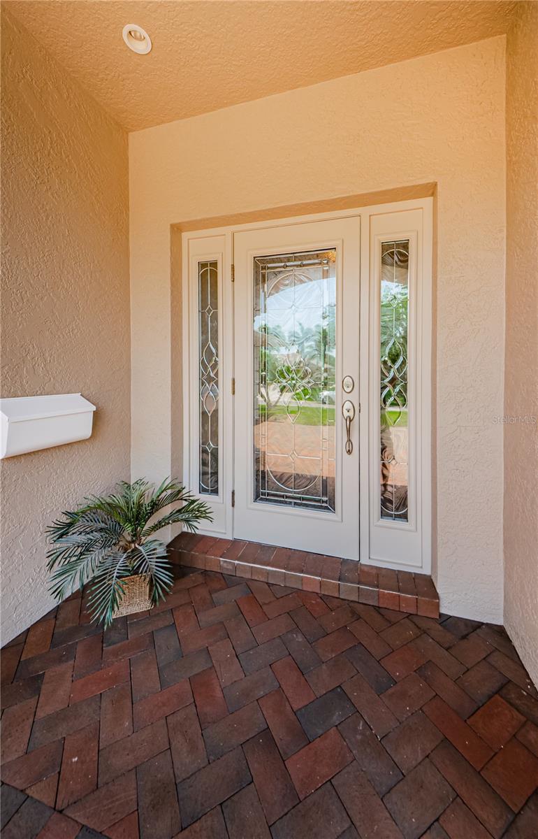 Beautiful newer front door with hurricane rated  impact glass!
