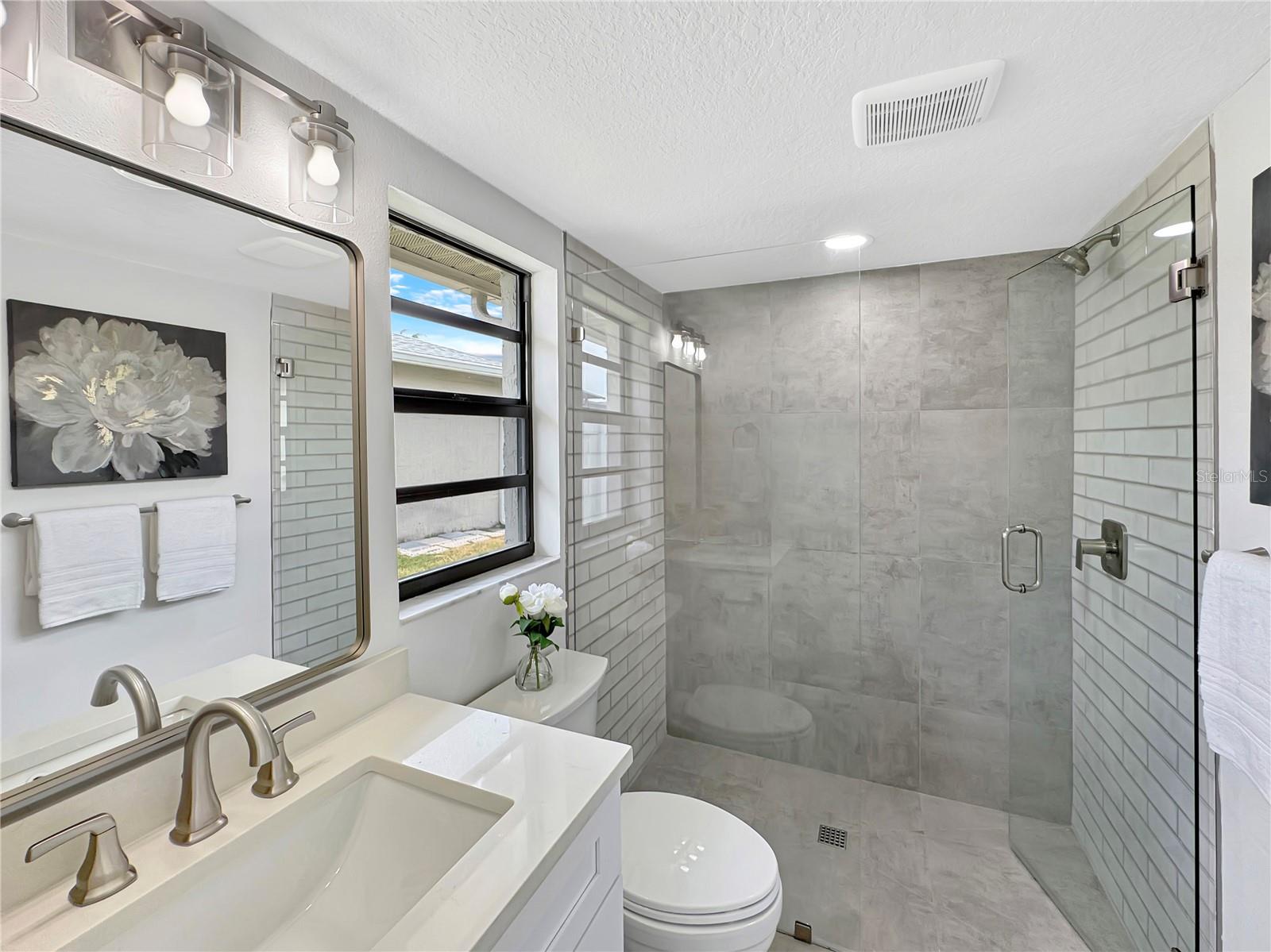 Primary Bathroom – Full View with Shower, Toilet & Sink