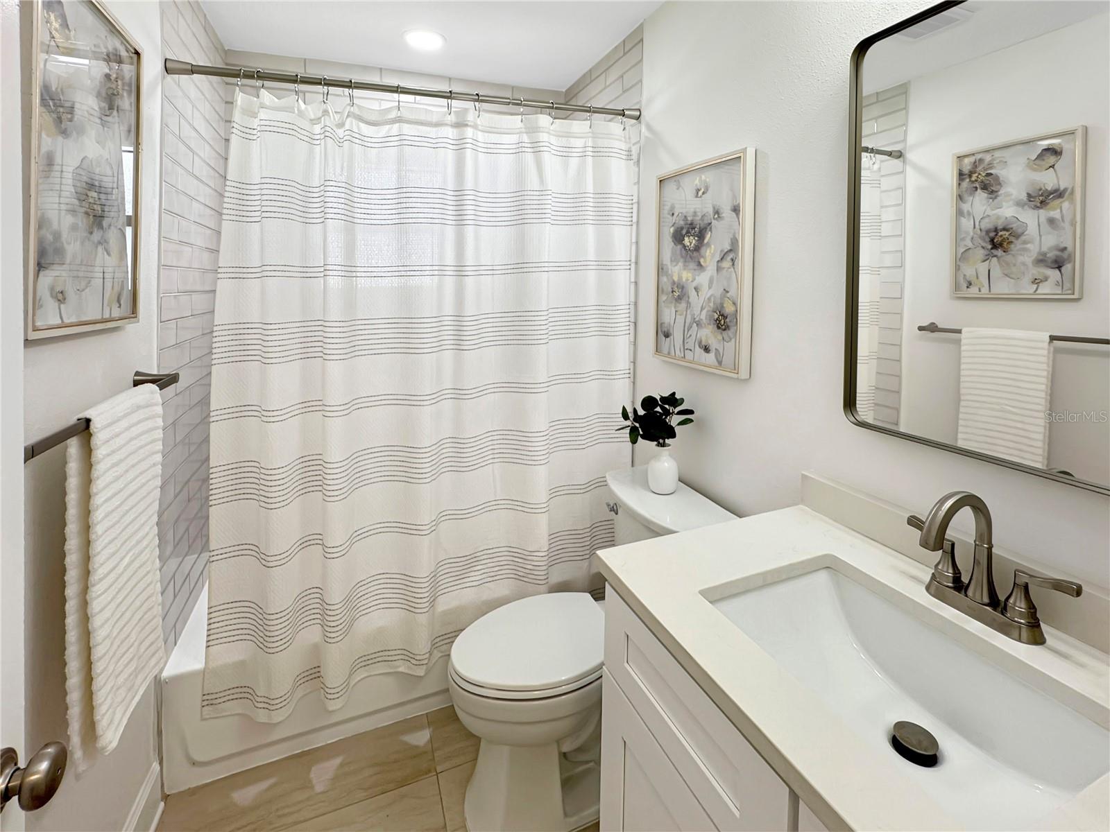 Guest Bathroom – Full View with Shower, Sink & Toilet