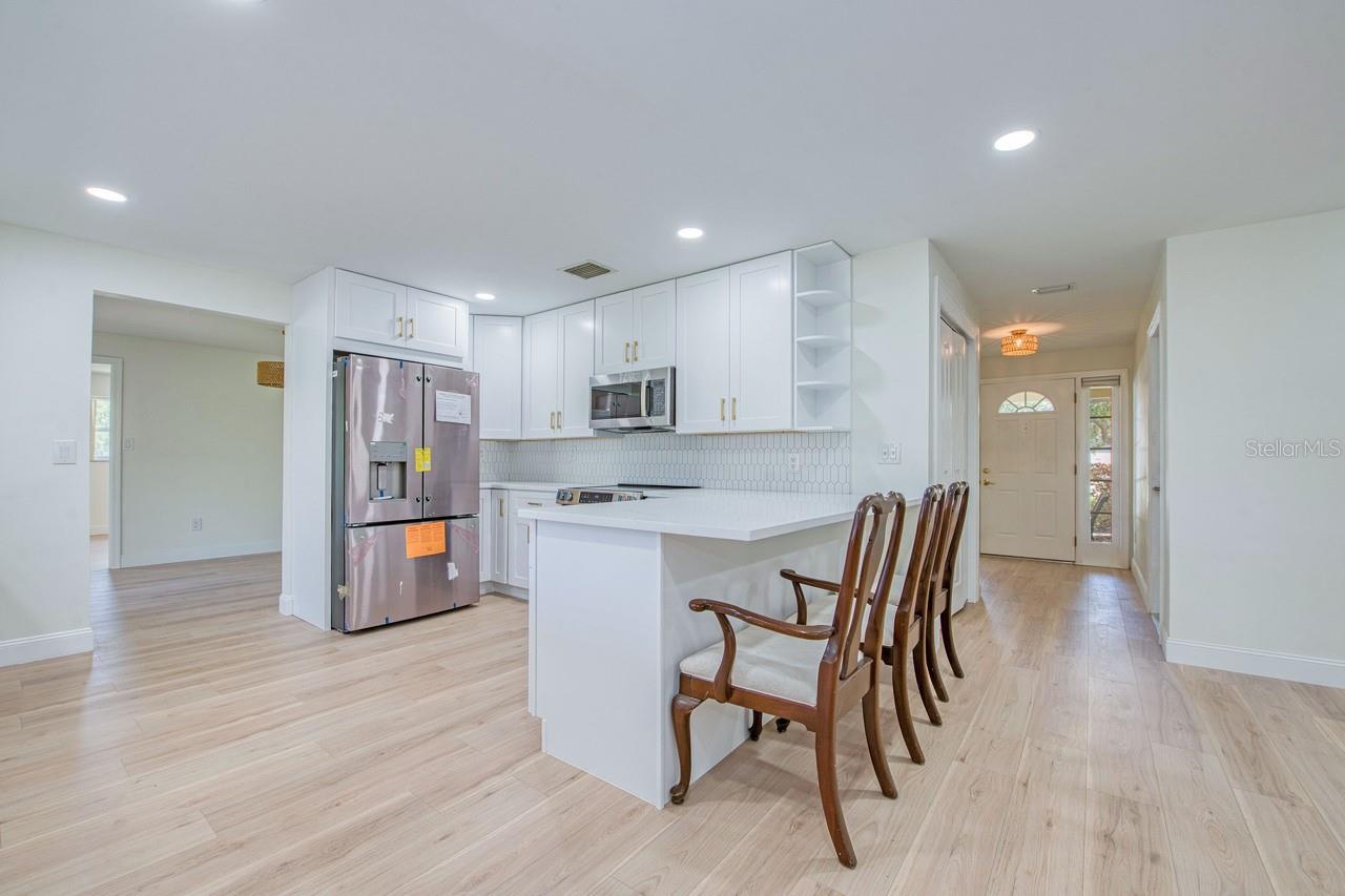 Kitchen Viewed From Family Room in Front of Fireplace
