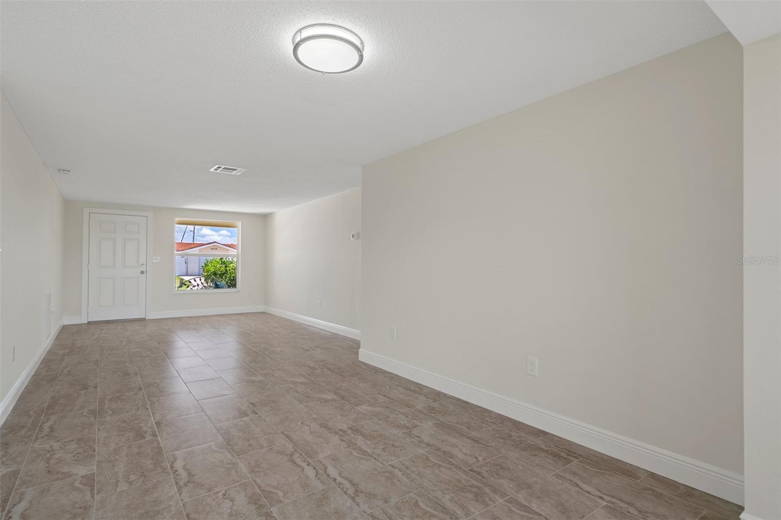 This room can be a large living room or dining room and living room combo