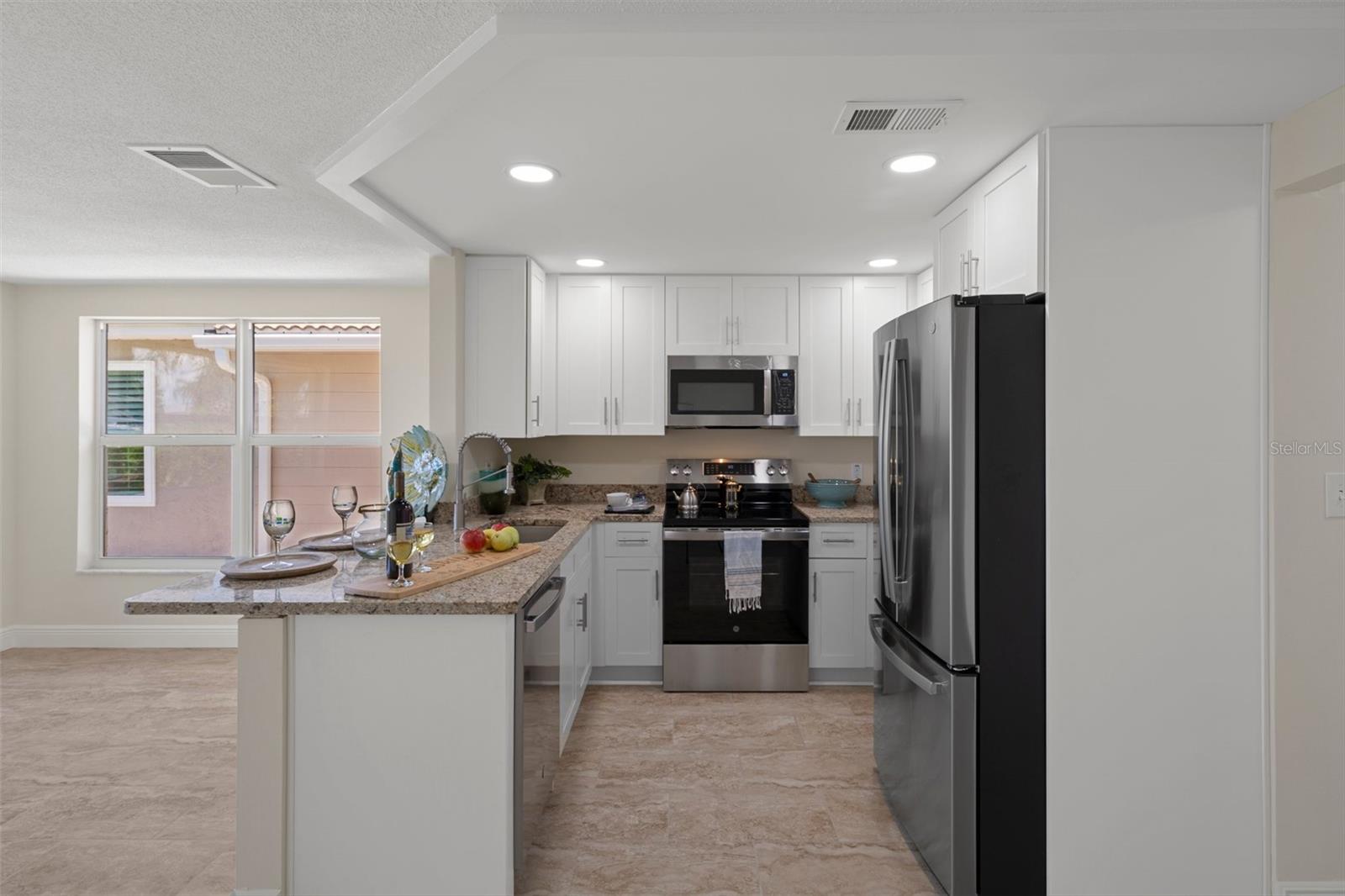 Perfect kitchen location - center of the entire house - great entertaining large groups.