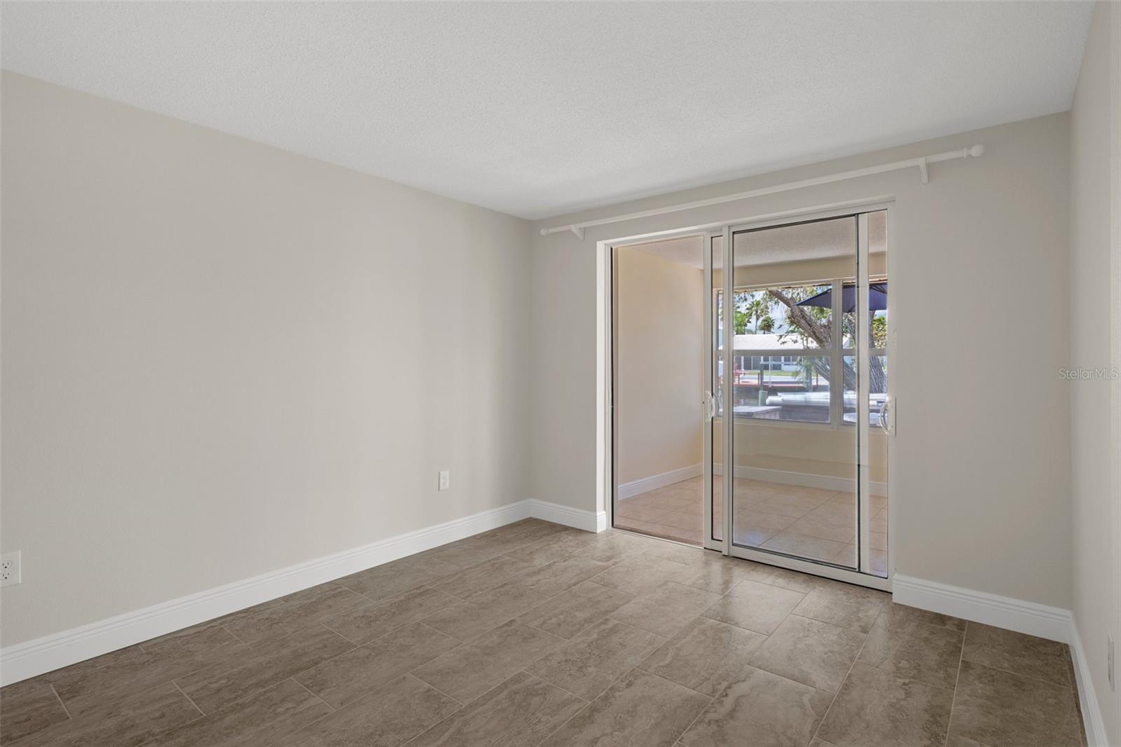 Guest Room has water view. sliding door out to Florida Room.