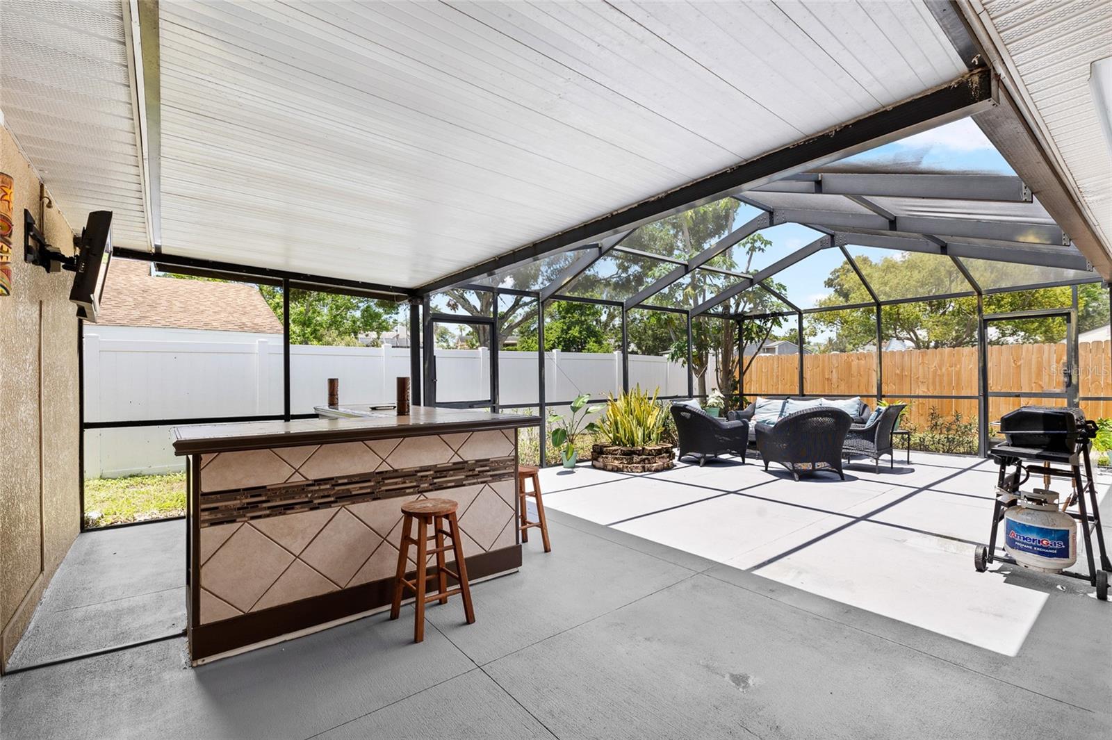 Entertainers paradise!  Covered bar area with huge screened lanai