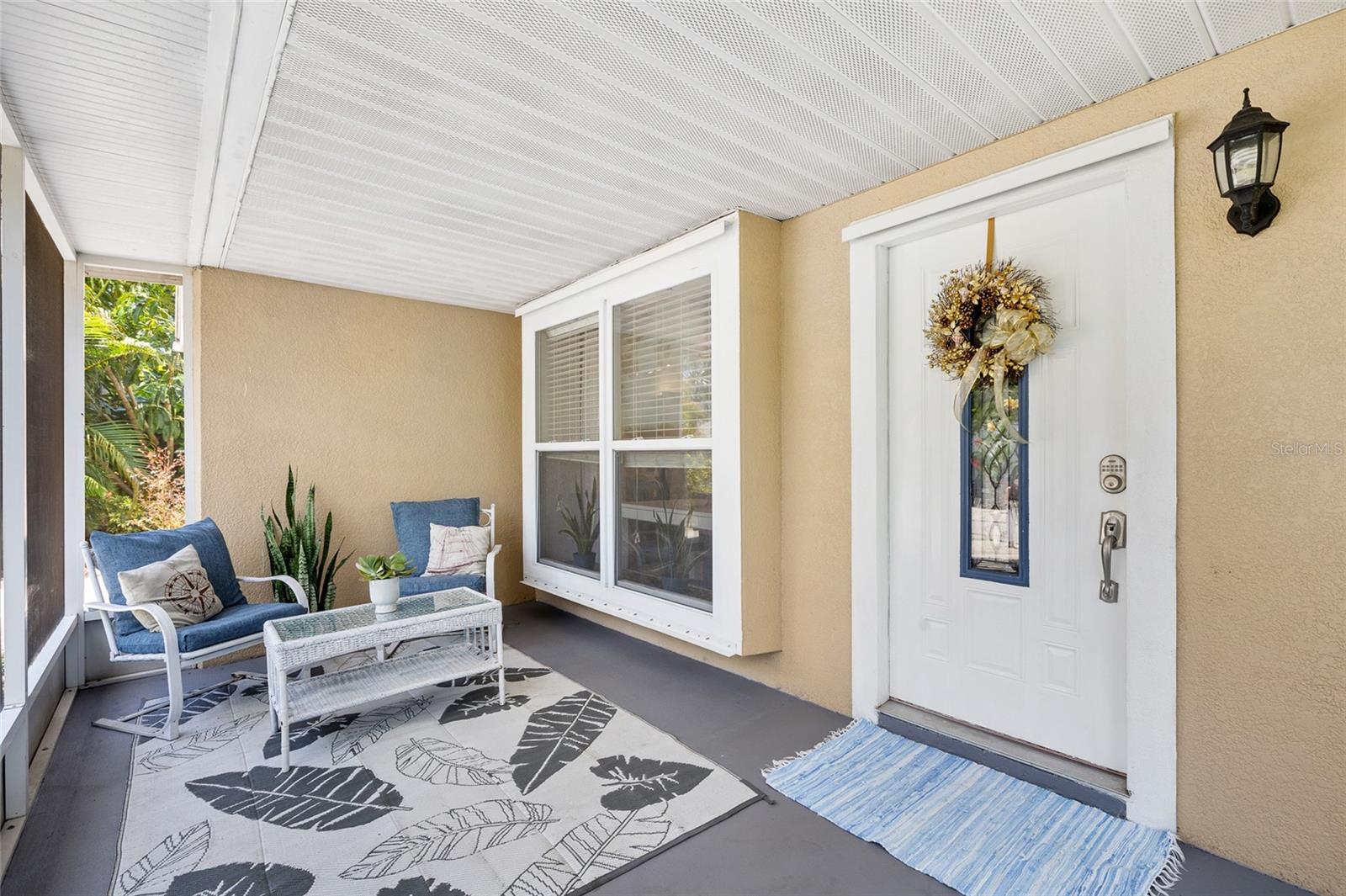 Relax on cozy screened front lanai