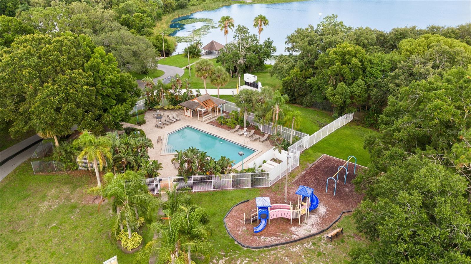 Community area boasts a shimmering pool and large playground for the kids