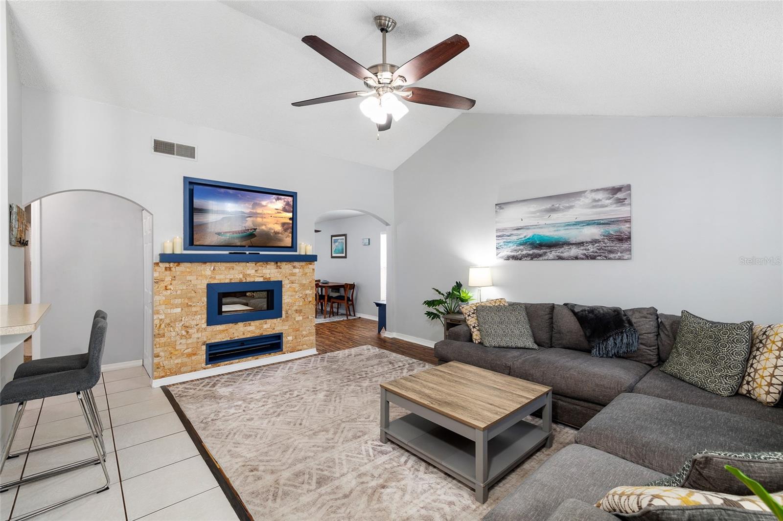 Enter to the spacious living room with built in TV and electric fireplace