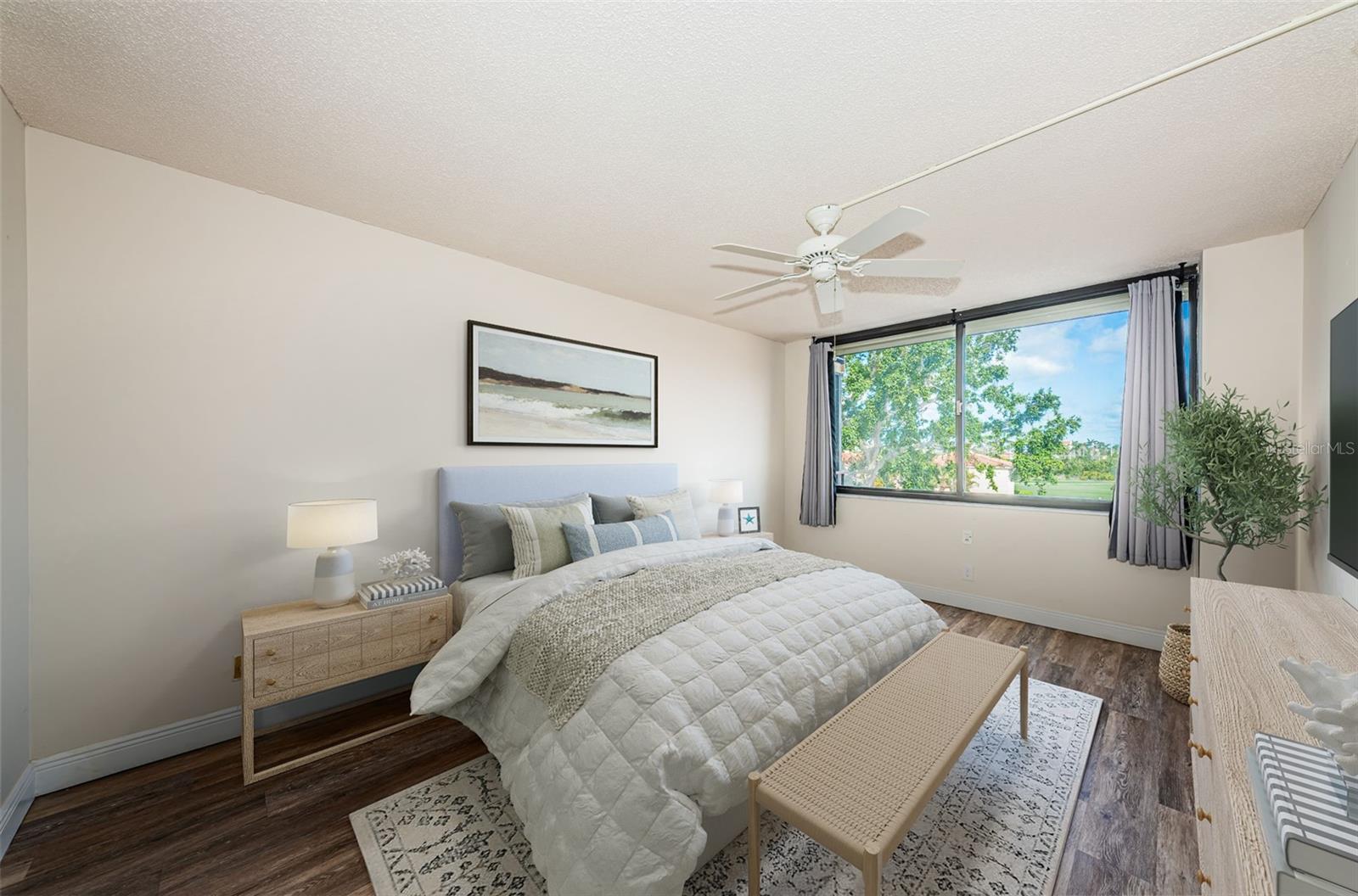 Peaceful primary suite with walk-in closet and golf water views to wake up to.