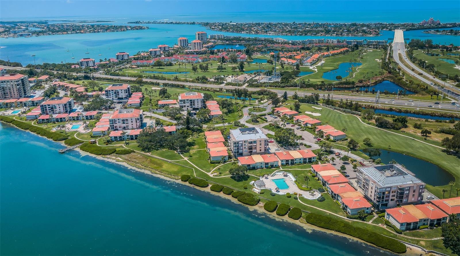 Kayak storage, on-site car wash, and lush tropical landscaping throughout the community.