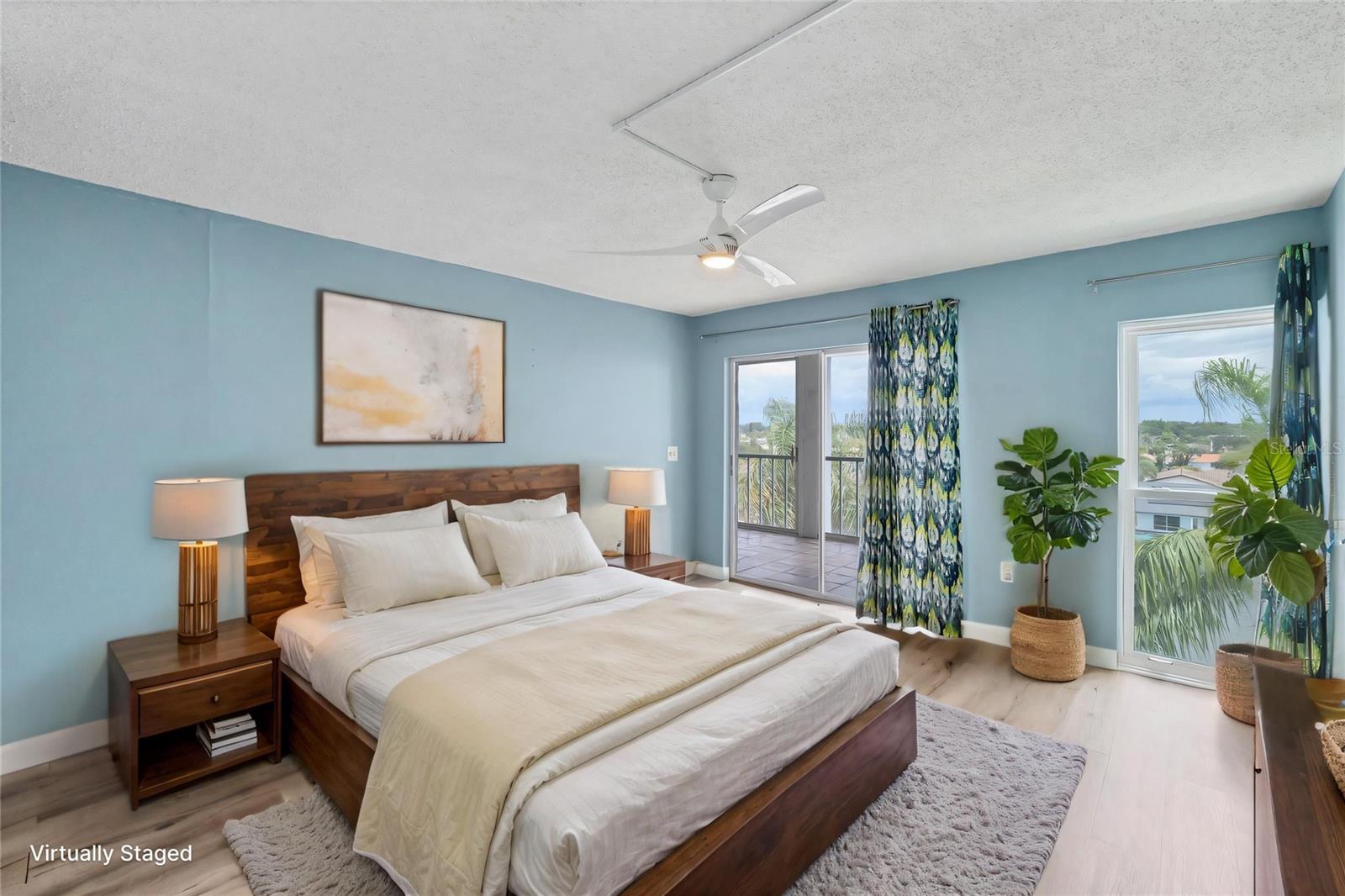 primary bedroom with sliding doors to the balcony