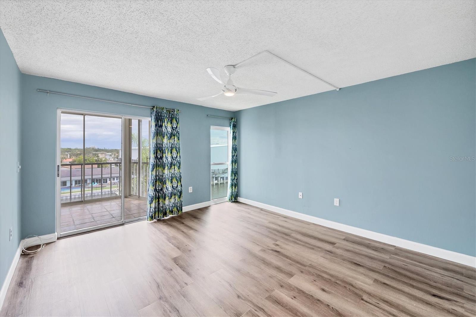 primary bedroom with marina and canal views