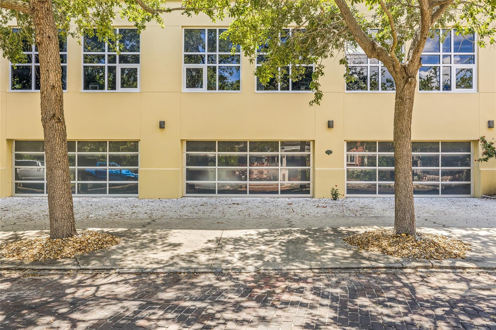 Enclosed garage space with one additional parking spot on the driveway behind the garage door.