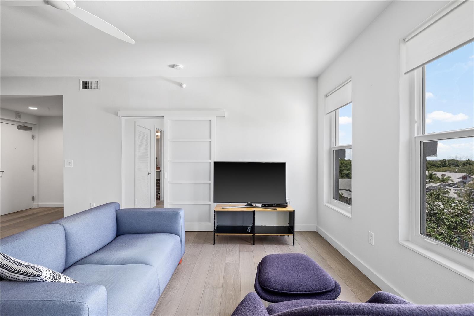 Shoji doors provide a stylish and private entrance to the bedrooms.