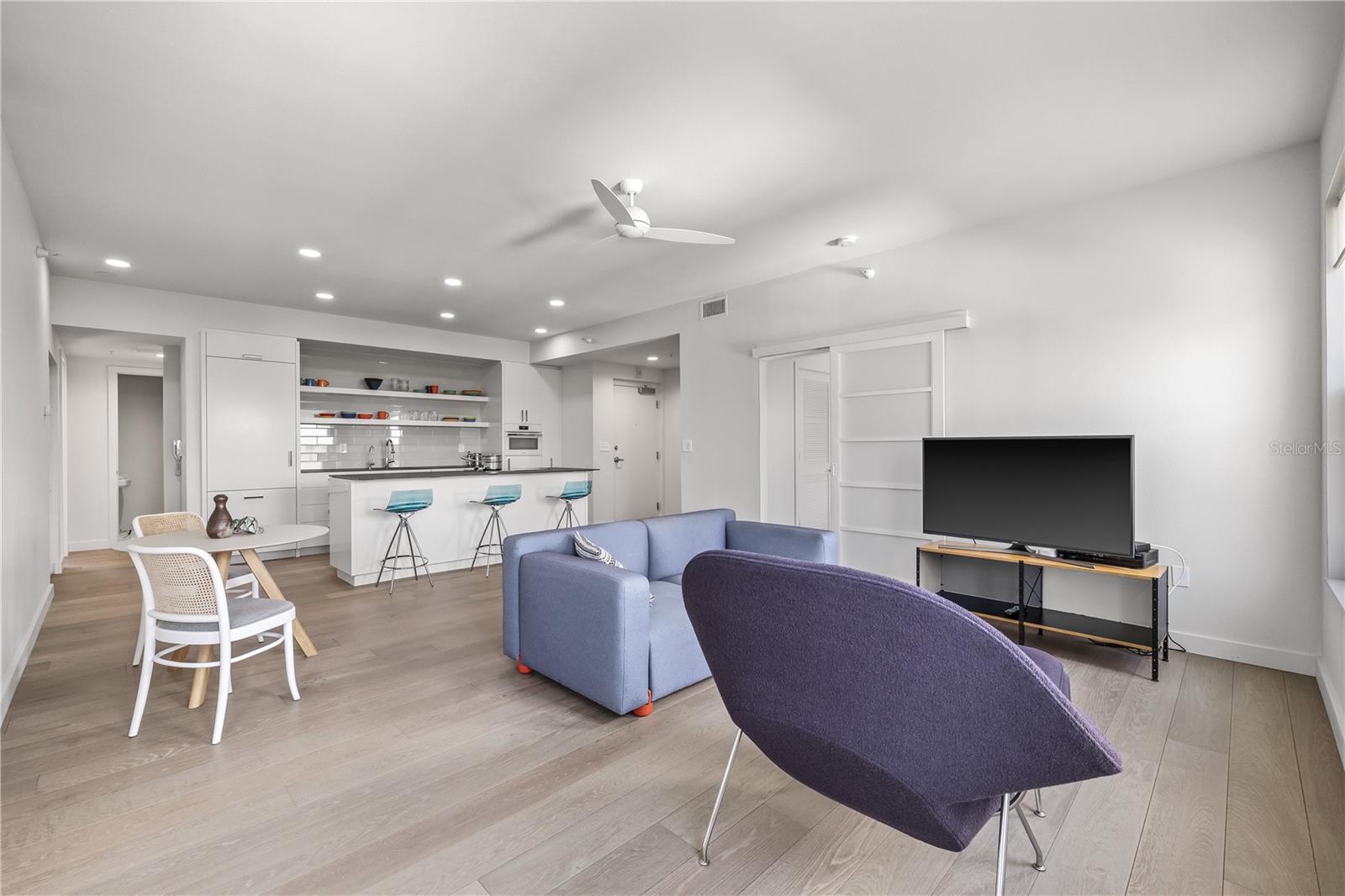 Open concept perfection with the living room blending to the kitchen and dining spaces.